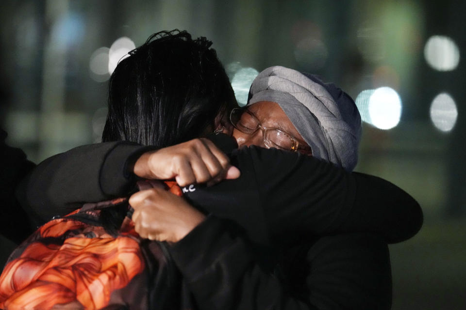 Sheneen McClain, right, is consoled by her friend, Midian Holmes, outside the Adams County Colo., Justice Center, after a verdict was rendered in the killing of her son Elijah McClain, Friday, Dec. 22, 2023, in Brighton, Colo. Two paramedics were convicted in the 2019 killing of McClain, who they injected with an overdose of the sedative ketamine after police put him in a neck hold. (AP Photo/David Zalubowski)
