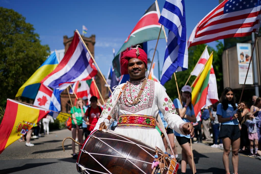 Performers take part in a ‘This is the City’ carnival through the streets of Coventry (PA) (PA Wire)