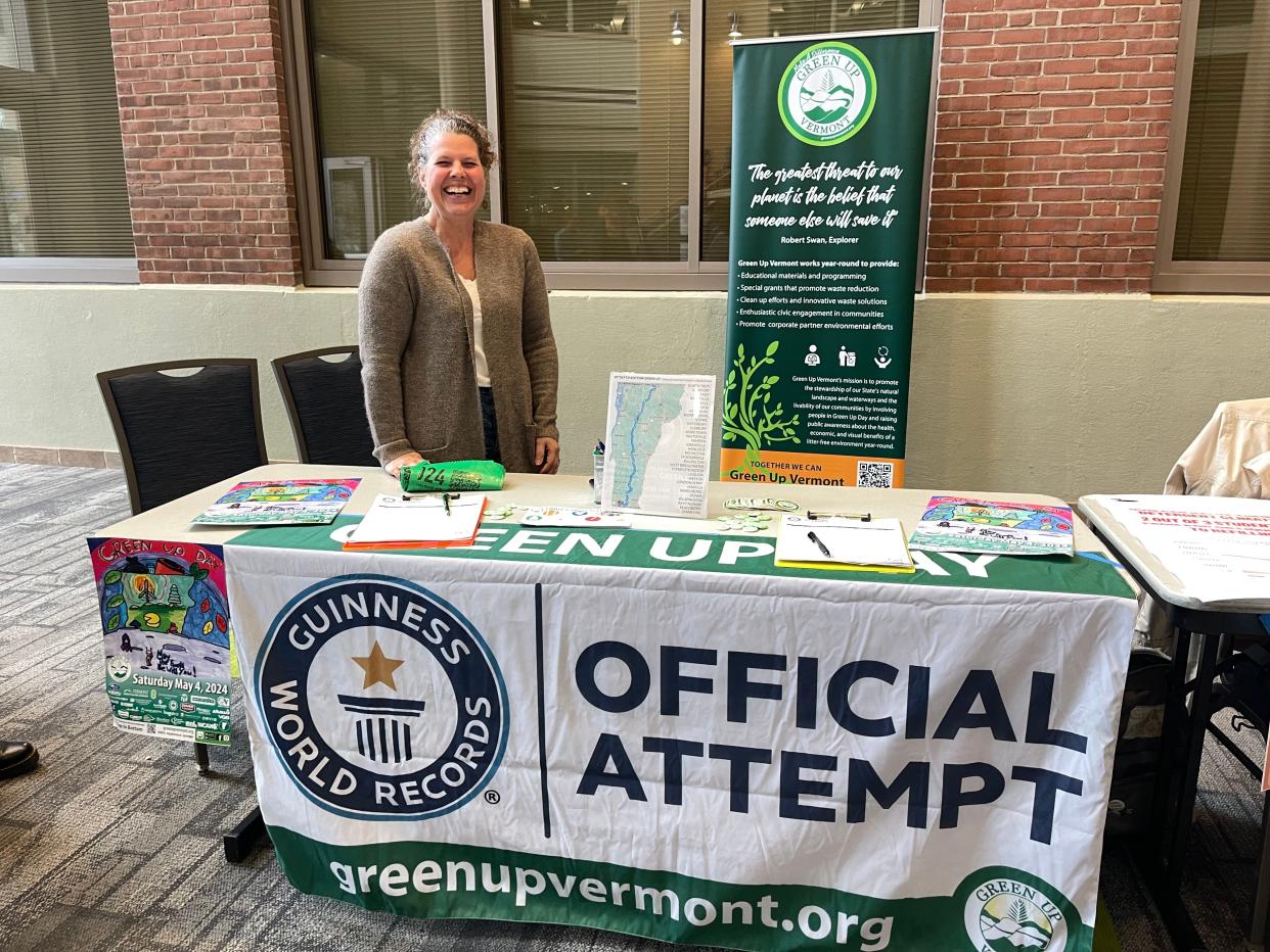Green Up Vermont Executive Director Kate Alberghini stands behind her table at the University of Vermont's Eco fair April 24, 2024.