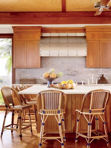 <p>MATTHEW MILLMAN</p> Wooden cabinets, as seen in this modern kitchen, rose to popularity in the 1960s and have stuck around since.