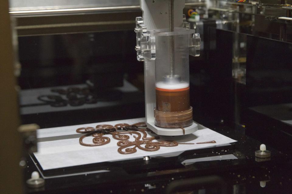 A 3D food printer by XYZprinting Inc. is demonstrated during the 2015 International Consumer Electronics Show (CES) in Las Vegas, Nevada January 4, 2015. The printer is expected to be available in the third quarter of 2015 but a price has not yet been established, a representative said. REUTERS/Steve Marcus