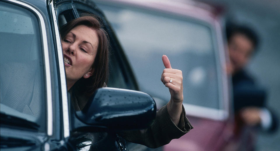 A woman looking angry in a car. Source: Getty Images