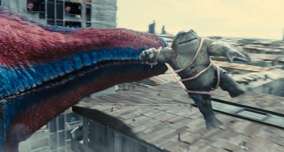 King Shark (voiced by Sylvester Stallone) tussles with a giant starfish in "The Suicide Squad."