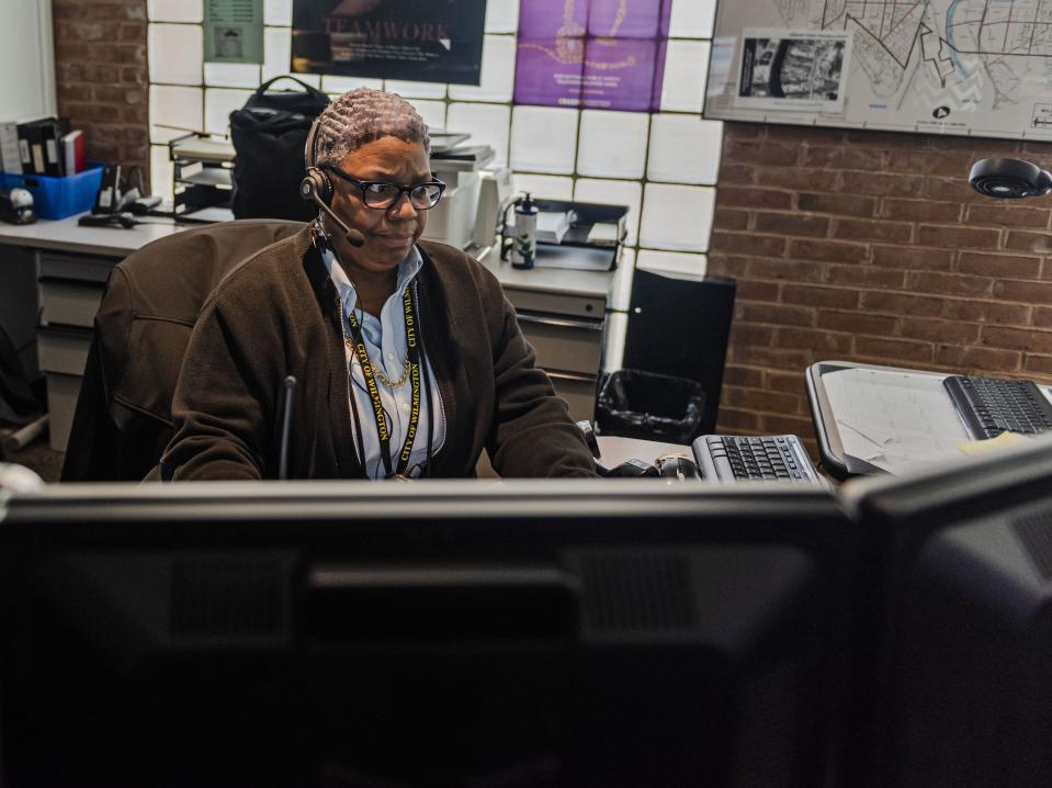 Wilmington communications supervisor Robin Henderson takes calls at the city's 911 Center. Henderson is the longest-tenured employee at the call center, having been hired in 1976.