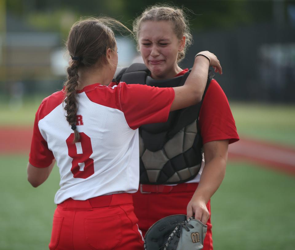 North Rockland's, from left, Hannah and Olivia Leon console each other after being defeated in the New York State Softball Championship semifinal by Shenendehowa on June 9, 2023. 
