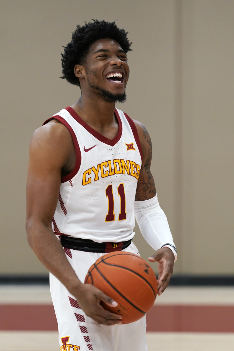 Iowa State guard Tyrese Hunter laughs with teammates during Iowa State's NCAA college basketball media day, Wednesday, Oct. 13, 2021, in Ames, Iowa. (AP Photo/Charlie Neibergall)