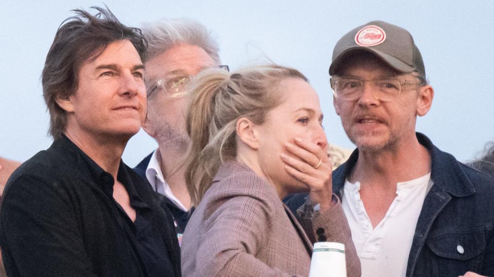 GLASTONBURY, ENGLAND - JUNE 29: Tom Cruise (L) and Simon Pegg ahead of Coldplay performing during day four of Glastonbury Festival 2024 at Worthy Farm, Pilton on June 29, 2024 in Glastonbury, England. Founded by Michael Eavis in 1970, Glastonbury Festival features around 3,000 performances across over 80 stages. Renowned for its vibrant atmosphere and iconic Pyramid Stage, the festival offers a diverse lineup of music and arts, embodying a spirit of community, creativity, and environmental consciousness. (Photo by Samir Hussein/WireImage)