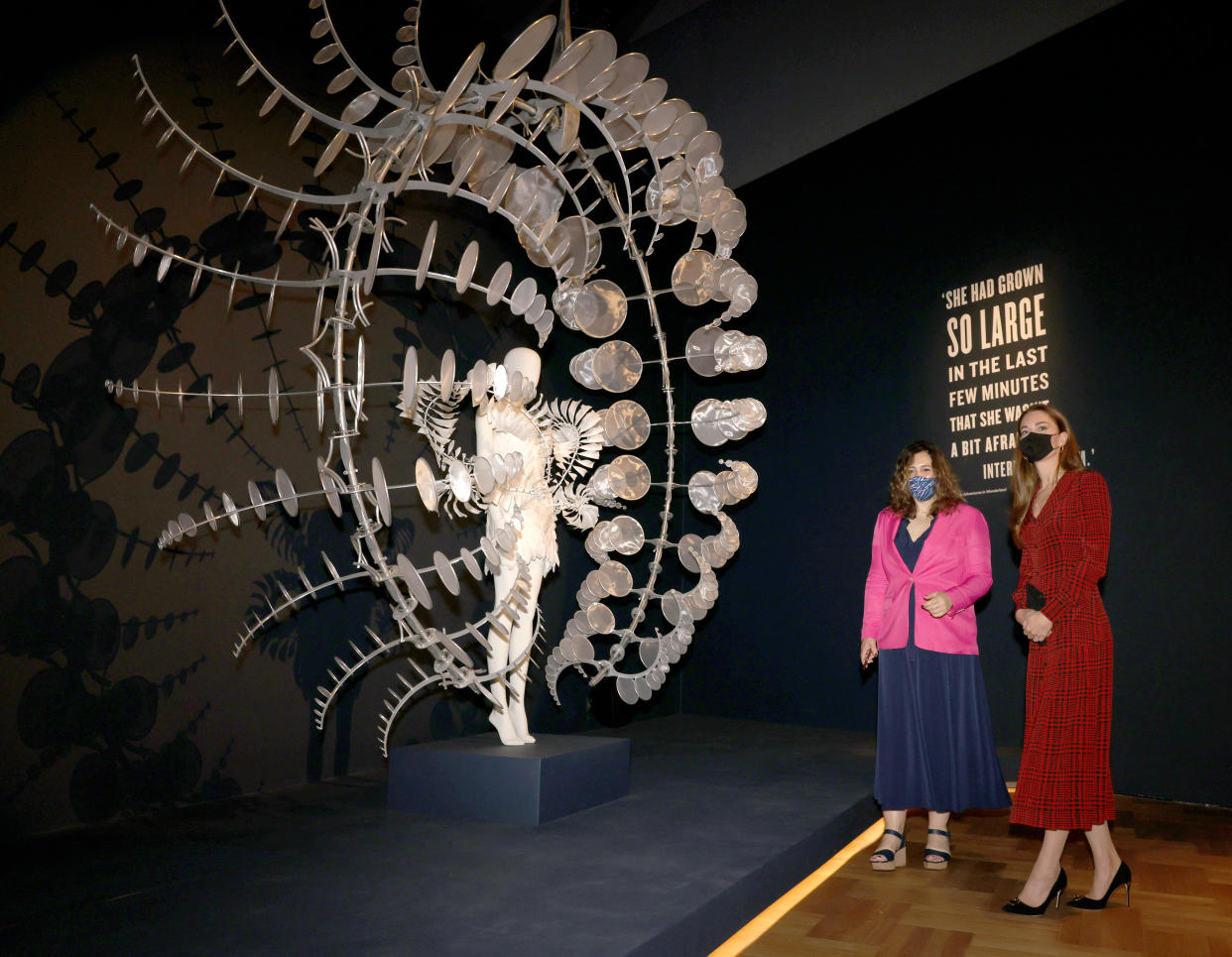 The Duchess of Cambridge in the Alice exhibition with curator Kate Bailey, looking at one of the costumes during a visit to V&A Museum in London. Picture date: Wednesday May 19, 2021.