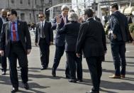 US Secretary of State John Kerry (center L) and US Secretary of Energy Ernest Moniz cross paths during a lunch break in negotiations with Iranian officials on March 27, 2015 in Lausanne. REUTERS/Brendan Smialowski/Pool