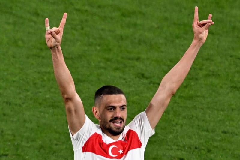 Merih Demiral of Turkey (R) celebrates after scoring his side's second goal during the UEFA Euro 2024 round of 16 soccer match between Austria and Turkey at the Leipzig Stadium. Hendrik Schmidt/dpa