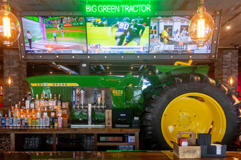 The John Deere 4020 Tractor Bar at Jason Aldean's Kitchen + Rooftop Bar in Gatlinburg, Tenn, pays homage to Aldean's song "Big Green Tractor."