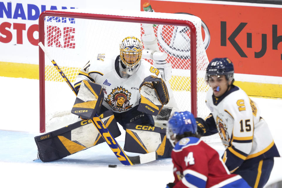 Shawinigan Cataractes goaltender Charles-Antoine Lavallee makes a save during the first period of the Memorial Cup hockey game against the Edmonton Oil Kings in Saint John, New Brunswick, Tuesday, June 21, 2022. (Darren Calabrese/The Canadian Press via AP)