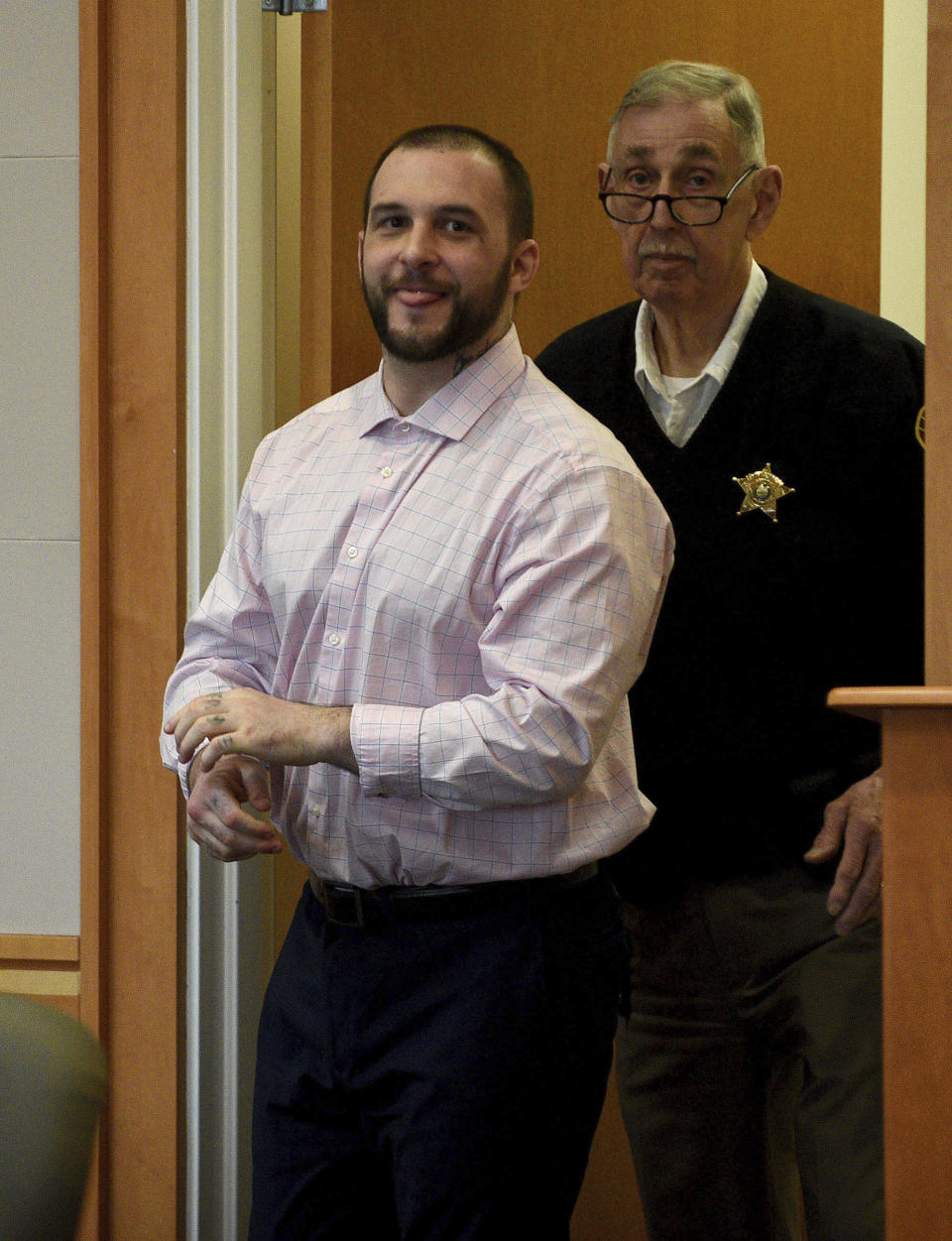 Adam Montgomery enters the courtroom for jury selection ahead of his murder trial at Hillsborough County Superior Court in Manchester, N.H, on Tuesday, Feb. 6, 2024. Montgomery is accused of killing his 5-year-old daughter and spending months moving her body before disposing of it. (David Lane/Union Leader via AP, Pool)