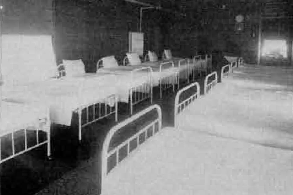 This undated image provided by the Alaska State Library shows the beds at Morningside Hospital in Portland, Ore. Volunteers have spent years digging through old records to identify about 5,500 Alaskans who were committed to a mental hospital in Oregon before Alaska gained statehood. (Alaska State Library, Historical Collections via AP)