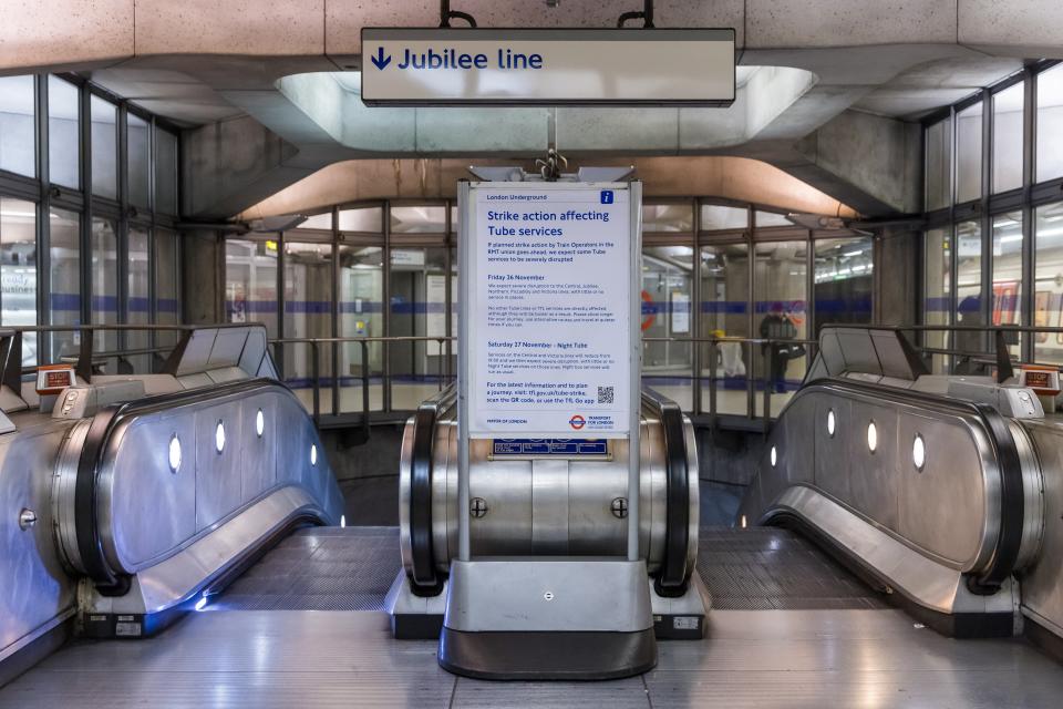 Signs inform passengers about the strike action affecting tube services at Westminster underground station (EPA)