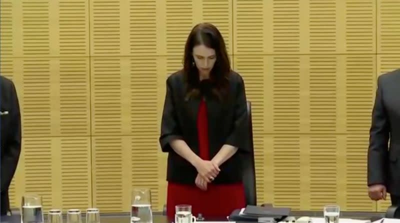 New Zealand's Prime Minister Ardern observes a minute of silence to mark one week since the deadly eruption of White Island