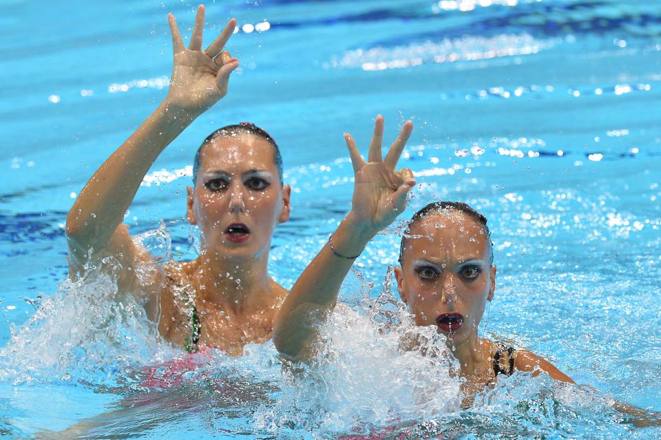 Italy's Giulia Lapi and Italy's Mariangela Perrupato compete in the duets free routine final during the synchronised swimming competition at the London 2012 Olympic Games on August 7, 2012 in London. AFP PHOTO / ALBERTO PIZZOLIALBERTO PIZZOLI/AFP/GettyImages