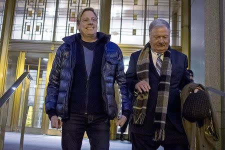 Financial advisor Dana Giacchetto (L) exits the Manhattan Federal Court house in New York December 11, 2014. REUTERS/Brendan McDermid