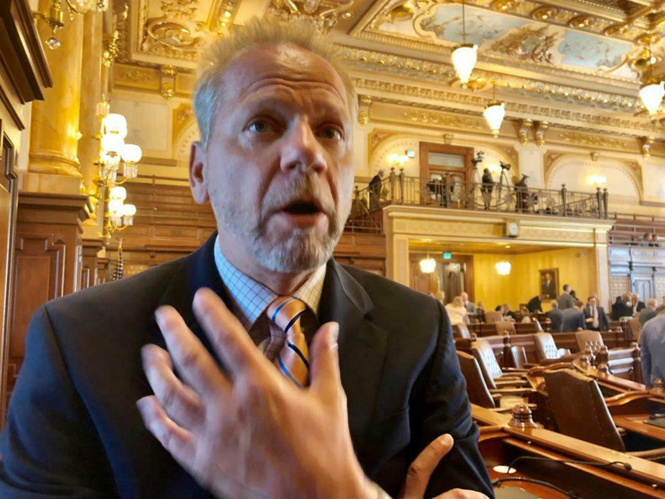 Sen. Dale Righter, R-Mattoon, denounces a 2.4% cost of living adjustment, Sunday, June 2, 2019, for lawmakers that would take effect in the Illinois budget after the House took no action to freeze lawmaker pay in legislation that got no discussion in the House during debates the previous day. "If we think we deserve one, then stand up and say it," Righter said. "Don't try to slip it through in the last hours of session." It would be the first pay raise for Illinois legislators since 2008, if Gov. J.B. Pritzker signs the budget proposal the General Assembly sent him. (AP Photo/John O'Connor)