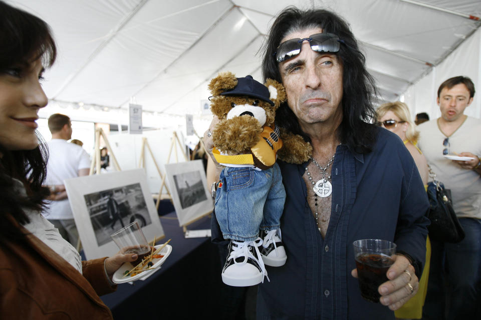 Alice Cooper holds a teddy bear at the 6th annual John Varvatos Stuart House Benefit in West Hollywood, California March 9, 2008. Stuart House is a program of the Rape Treatment Center at Santa Monica-UCLA Medical Center and serves the special needs of child victims of sexual abuse.   REUTERS/Mario Anzuoni   (UNITED STATES)