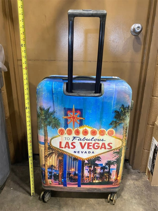 The child’s body was found inside a closed hard case suitcase with a distinctive Las Vegas design on its front and back. (Indiana State Police)