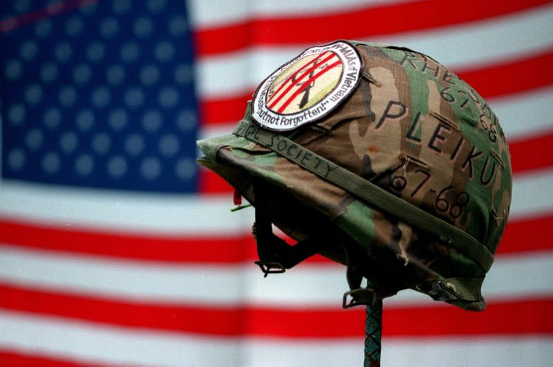 A shrine dedicated to the POW/MIA soldiers of the Vietnam and Korean Wars sits with a backdrop of an American flag on the mall, May 25, 1998. On September 29, 1965, Communist North Vietnam announced that U.S. pilots taken prisoner would be tried as war criminals. File Photo by Michael Smith/UPI