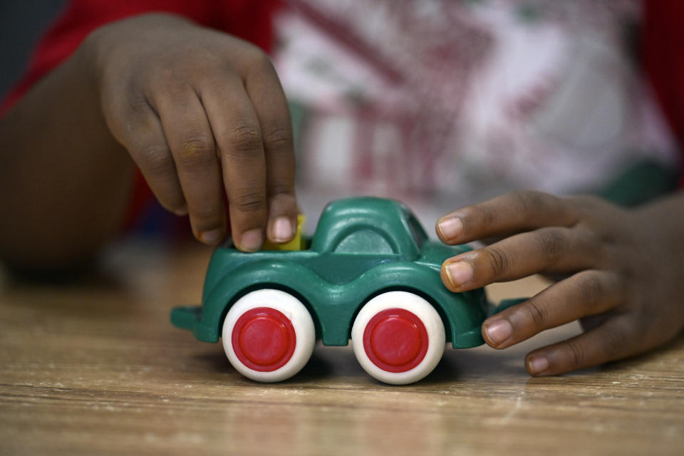 A child plays with a toy at a Head Start program at Alliance for Community Empowerment, Thursday, Sept. 28, 2023, in Bridgeport, Conn. Head Start programs serving more than 10,000 disadvantaged children would immediately lose federal funding if there is a federal shutdown, although they might be able to stave off immediate closure if it doesn't last long. (AP Photo/Jessica Hill)