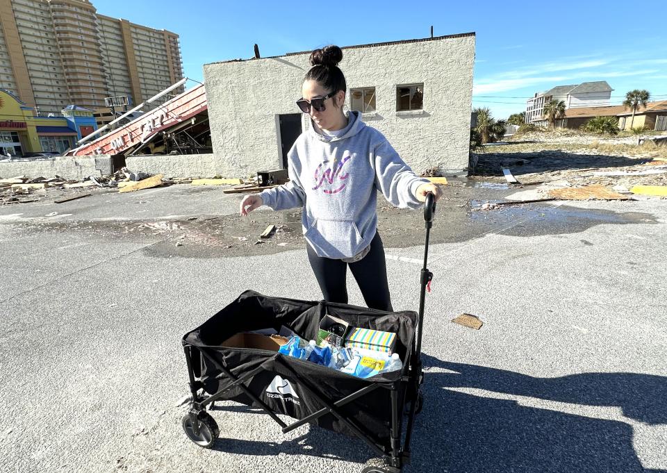 Ashley Sainz, who lives on Panama City Beach, was out with her wagon taking items around to those in need on Wednesday morning.