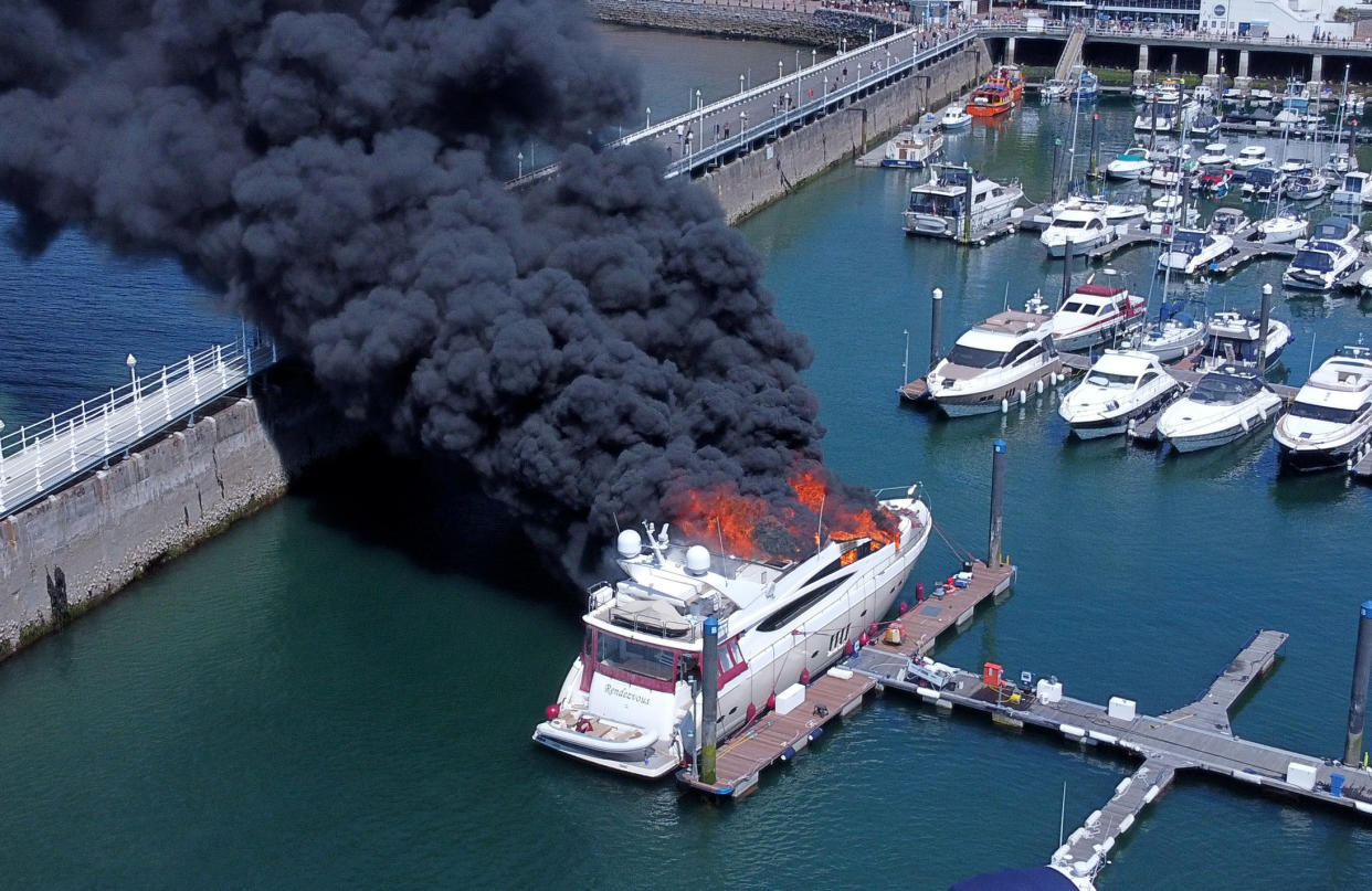 The £6 million superyacht is now sitting at the bottom of the harbour. (SWNS)