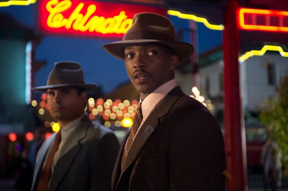 This film image released by Warner Bros. Pictures shows Michael Pena, left, as Officer Navidad Ramirez and Anthony Mackie, as Officer Coleman Harris, in “Gangster Squad." (AP Photo/Warner Bros. Pictures, Jamie Trueblood)