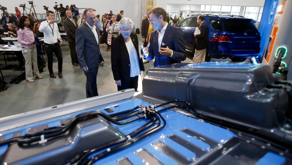 Gov. Kay Ivey, center, views a general model of a battery as Markus Schaefer, head of production planning, explains how it will be used in future electric cars produced at Mercedes-Benz U.S. International during the 20-year celebration at MBUSI  in Vance on Thursday, Sept. 21, 2017.