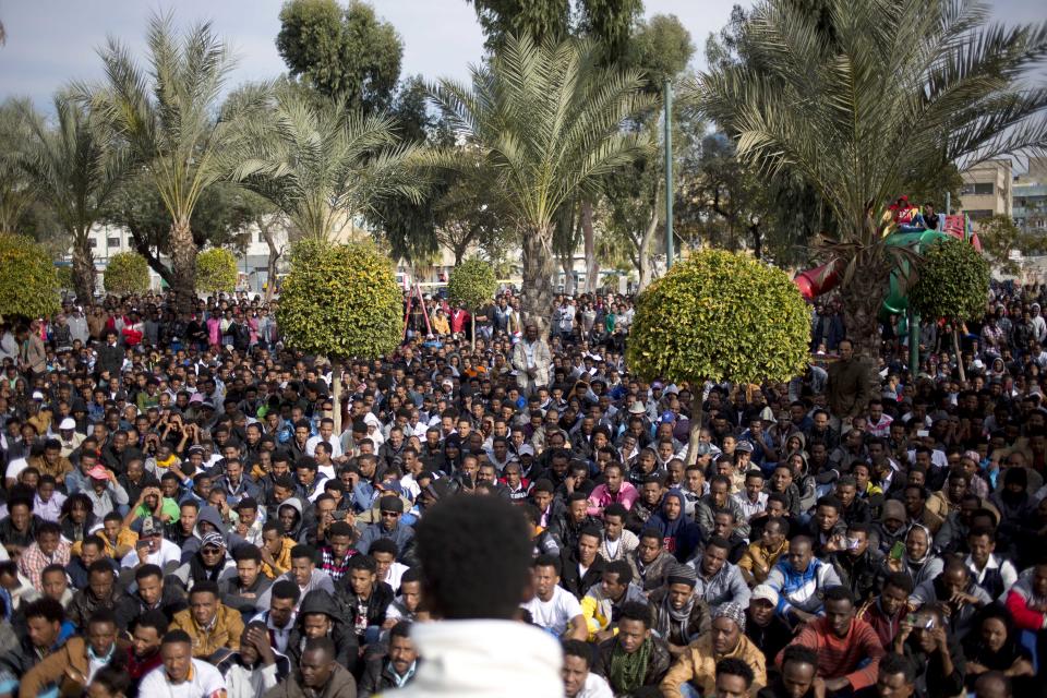 African migrants gather during a protest in Lewinsky park in Tel Aviv, Israel, Tuesday, Jan. 7, 2014. The migrants, some of whom are menial laborers in Israel, have been on a three-day strike. About 60,000 African migrants, mostly from Sudan and Eritrea, have trekked through Egypt and other Muslim countries to reach Israel in recent years. Some are fleeing violence or oppression in their home countries while others are seeking better economic opportunities. (AP Photo/Ariel Schalit)