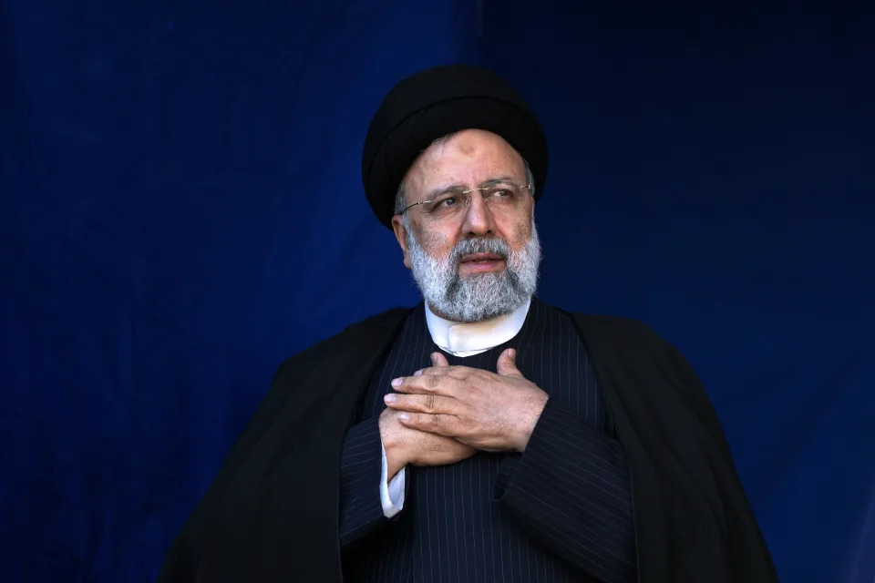 FILE- Iranian President Ebrahim Raisi places his hands on his heart as a gesture of respect to the crowd during the funeral ceremony of the victims of Wednesday's bomb explosion in the city of Kerman about 510 miles (820 kms) southeast of the capital Tehran, Iran, Jan. 5, 2024. A helicopter carrying Iranian President Ebrahim Raisi suffered a “hard landing” on Sunday, May 19, 2024, Iranian state television reported, without immediately elaborating. (AP Photo/Vahid Salemi, File)