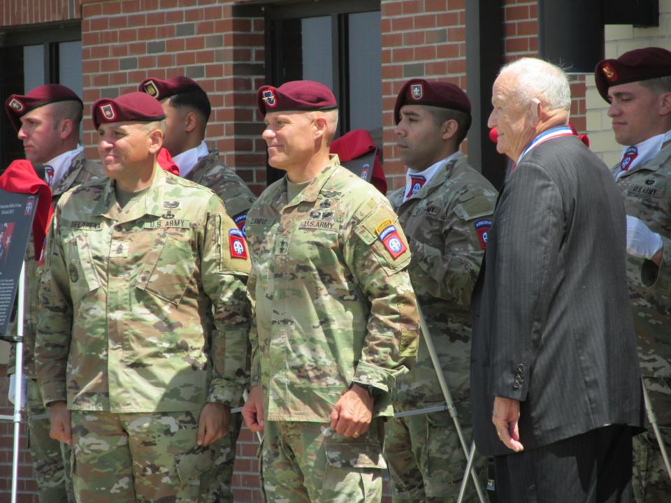 Retired Lt. Gen. Freddy McFarren, far right, is congratulated by  Maj. Gen. Christopher LaNeve, second from right, and Command Sgt. Maj. Randolph Delapena, after being inducted into the 82nd Airborne Division Hall of Fame during a ceremony Wednesday, May 24, 2023, at Fort Bragg.