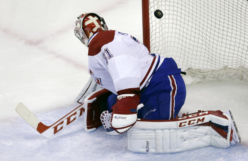 Montreal Canadiens goalie Carey Price (31) looks back as he is beat for a goal by Boston Bruins center Carl Soderberg during the first period of Game 5 in the second-round of the Stanley Cup hockey playoff series in Boston, Saturday, May 10, 2014. (AP Photo/Charles Krupa)