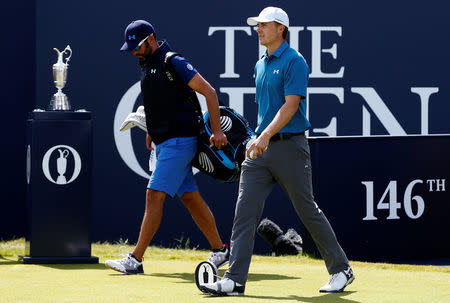 Golf - The 146th Open Championship - Royal Birkdale - Southport, Britain - July 23, 2017 USA’s Jordan Spieth and his caddie walk past The Claret Jug on their way to the first tee during the final round REUTERS/Andrew Boyers