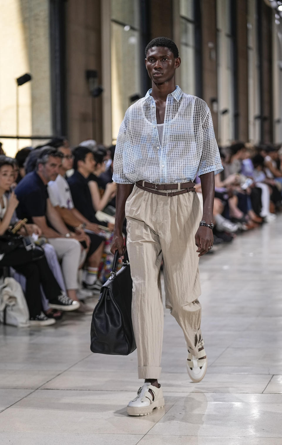 A model wears a creation for the Hermes Menswear Spring/Summer 2024 fashion collection presented in Paris, Saturday, June 24, 2023. (AP Photo/Michel Euler)