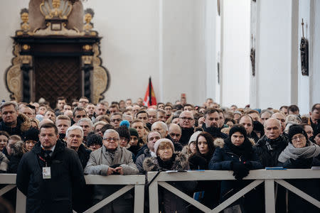 People attend a funeral service for the city's mayor Pawel Adamowicz at St Mary's Basilica in Gdansk, Poland January 19, 2019. Agencja Gazeta/Bartosz Banka via REUTERS