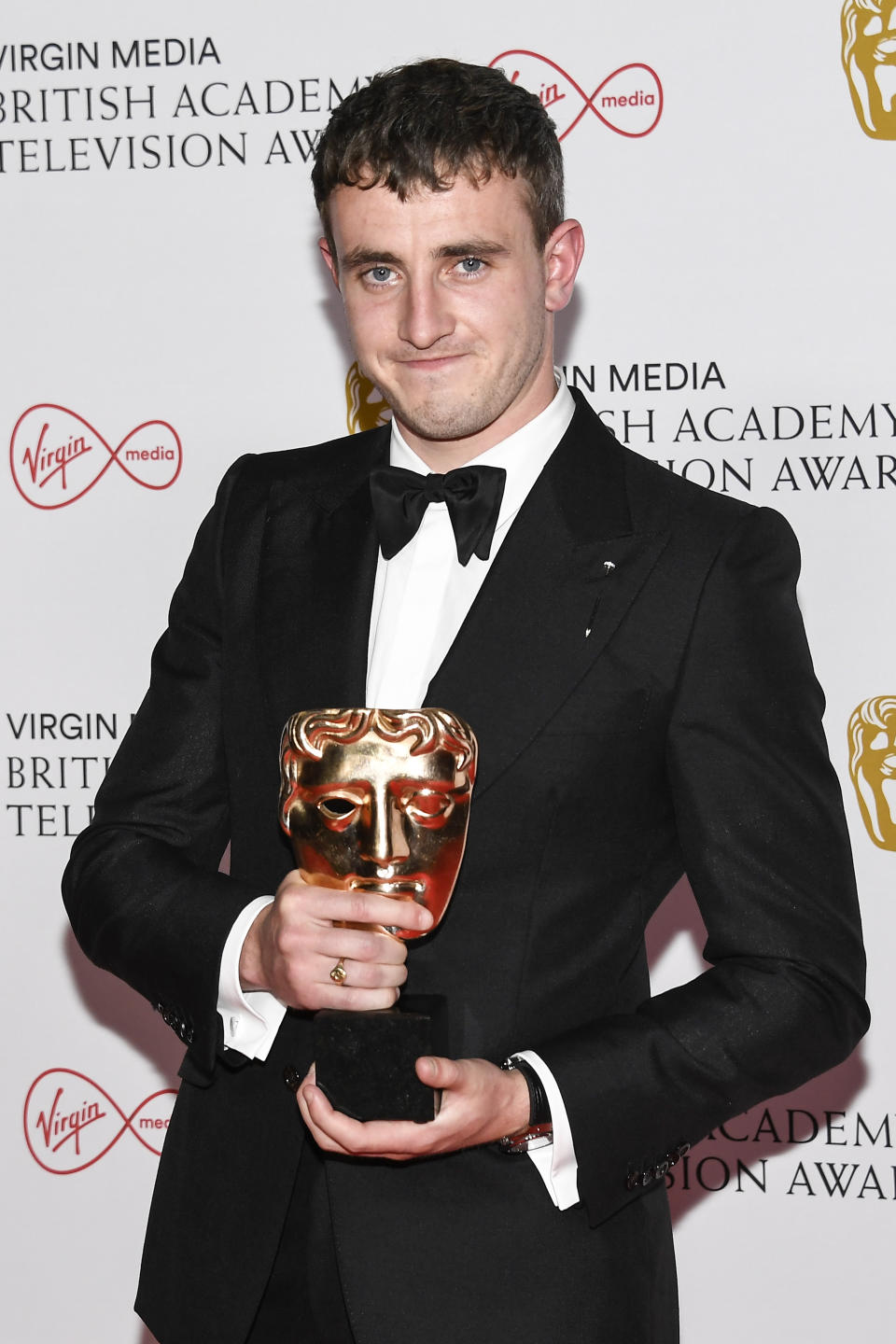 Paul Mescal poses for photographers with his Leading Actor award for his role in 'Normal People' backstage at the British Academy Television Awards in London, Sunday, June 6, 2021. (AP Photo/Alberto Pezzali)