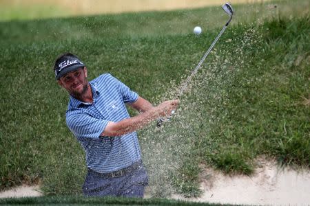 Jul 2, 2017; Potomac, MD, USA; Spencer Levin plays from a bunker on the seventh hole during the final round of the Quicken Loans National golf tournament at TPC Potomac at Avenel Farm. Mandatory Credit: Peter Casey-USA TODAY Sports