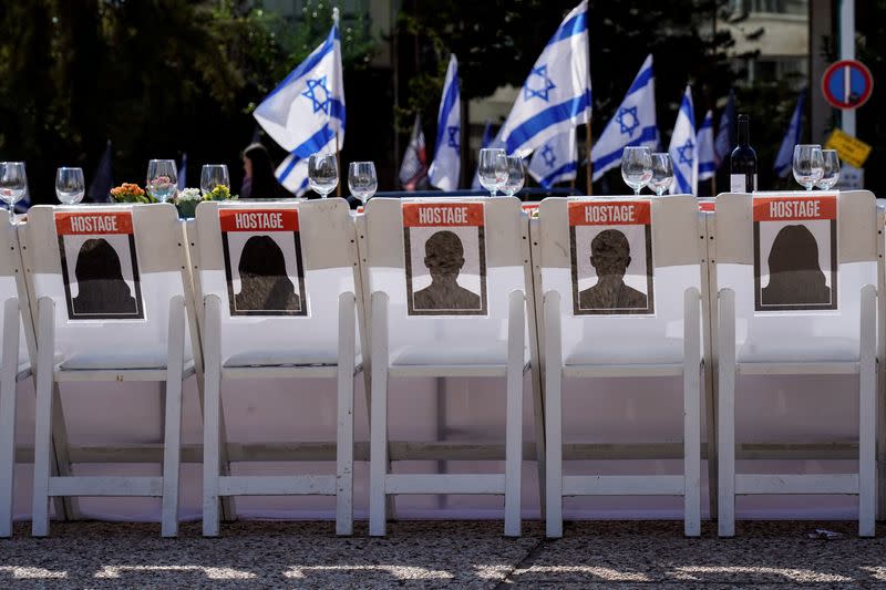 FILE PHOTO: A dinner table is set with empty chairs that symbolically represent hostages and missing people with families that are waiting for them to come home, following a deadly infiltration by Hamas gunmen from the Gaza Strip, in Tel Aviv