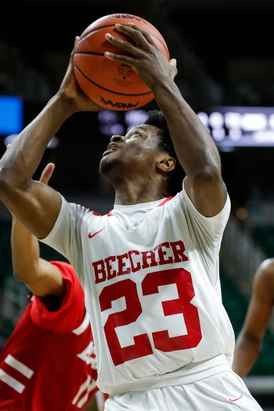 Flint Beecher forward Jaylen Townsend (23) goes to the basket against Ecorse during the first half of the MHSAA boys Division 3 semifinals at Breslin Center in East Lansing on Thursday, March 23, 2023.