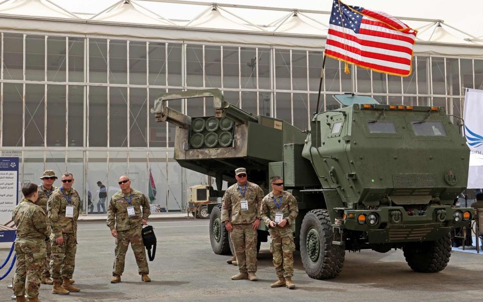 US troops stand beside a Himars missile system during Saudi Arabias first World Defense Show in March 2022 - FAYEZ NURELDINE 