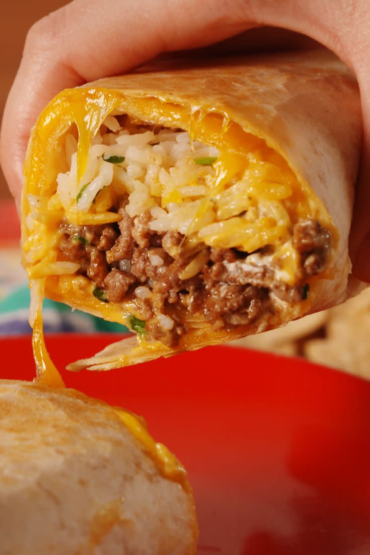 <p>Believe your eyes: This quesadilla-meets-burrito inception is a a new level of cheesiness. We'll never make burritos the same way again! </p><p>Get the <strong><a href="https://www.delish.com/cooking/recipe-ideas/recipes/a52462/quesarito-recipe/" rel="nofollow noopener" target="_blank" data-ylk="slk:Quesarito recipe;elm:context_link;itc:0;sec:content-canvas" class="link ">Quesarito recipe</a></strong>. </p>