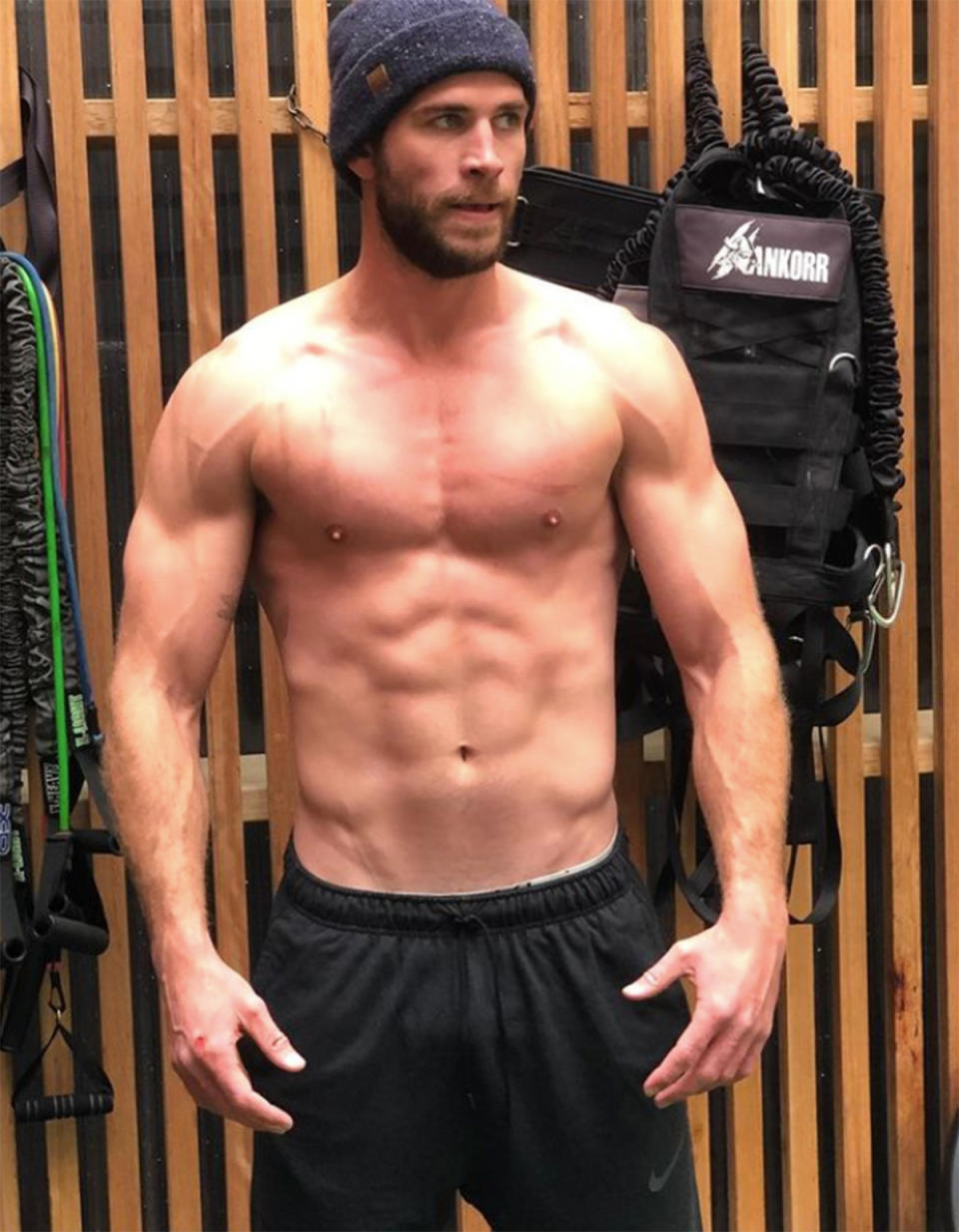 Liam Hemsworth with his top off in the gym