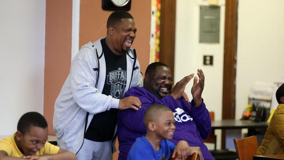 Pastor Kenneth Simmons and John Smith laugh over a question one of the boys asked the speaker during a presentation at the Resource Council of Western New York in Buffalo.  The two men, lifelong friends, are mentors to the youth and meet their weekly.