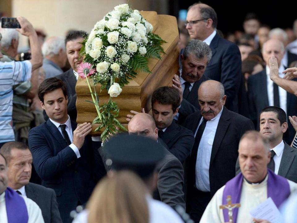 The sons of murdered journalist Daphne Caruana Galizia carry their mother’s coffin from the church in Mosta (AFP/Getty)