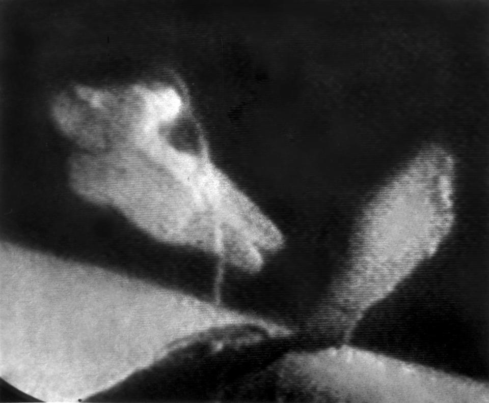 FILE - In this March 18, 1965 photo made from a television screen, Soviet cosmonaut Lexei Leonov, left, floats in space at the end of a lifeline during a twenty minute trip outside the Russian spacecraft Voskhod-2 during an orbital flight. On Friday, Oct. 11, 2019, the Russian space agency Roscosmos announced that Leonov, who became the first human to walk in space 54 years ago _ and nearly didn’t make it back into his capsule _ died in Moscow. He was 85. (AP Photo)