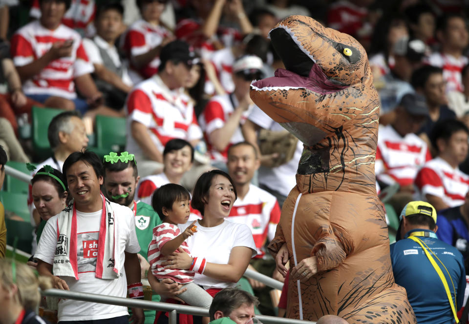 Fans react as they wait for the start of the Rugby World Cup Pool A game at Shizuoka Stadium Ecopa between Japan and Ireland in Shizuoka, Japan, Saturday, Sept. 28, 2019. (AP Photo/Jae Hong)