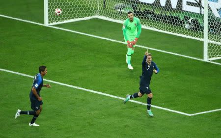 Soccer Football - World Cup - Final - France v Croatia - Luzhniki Stadium, Moscow, Russia - July 15, 2018 France's Antoine Griezmann celebrates scoring their second goal with Raphael Varane REUTERS/Michael Dalder